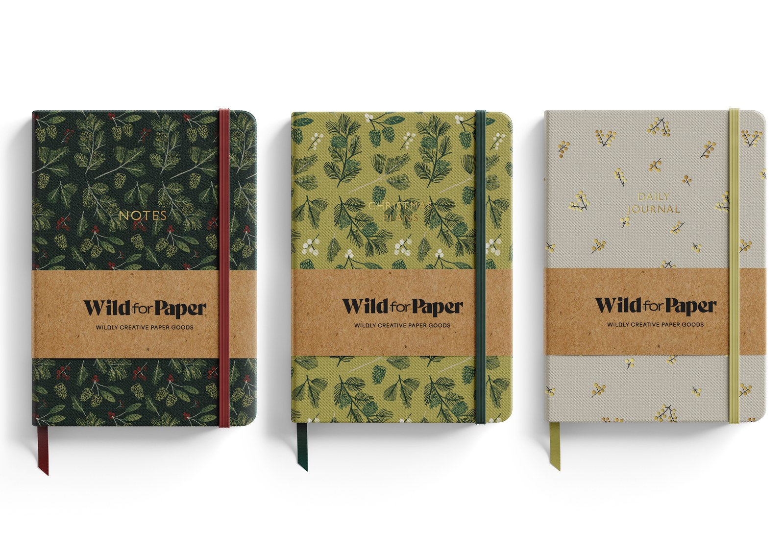 Wild for Paper journal collection — three botanical-print journals with kraft branded belly bands.